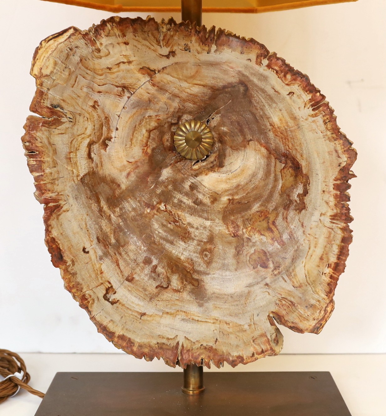 A bronze and petrified wood table lamp, height 60cm. width 28cm